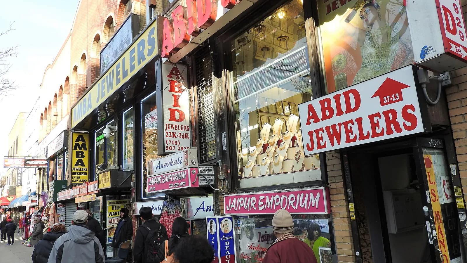 Shops and signs along 74th Street in Jackson Heights, Queens